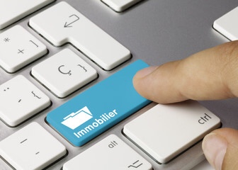 Ordinateur avec une touche permettant de créer la publicité de mes annonces immobilières